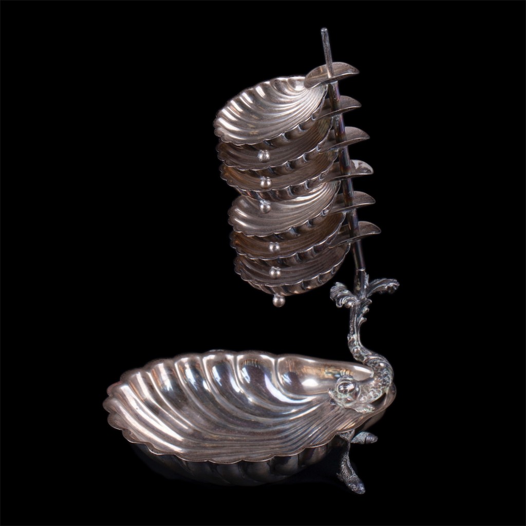 Silver serving set in a shape of shells.