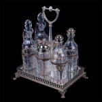 Antique silver cruet stand of 6 pieces