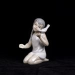 Spain porcelain figure of a girl with a dove