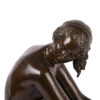 Bronze figure. “Femme nue aux colombes”