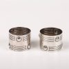 A pair of silver napkin rings