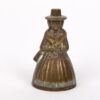 Antique brass bell in a shape of a woman