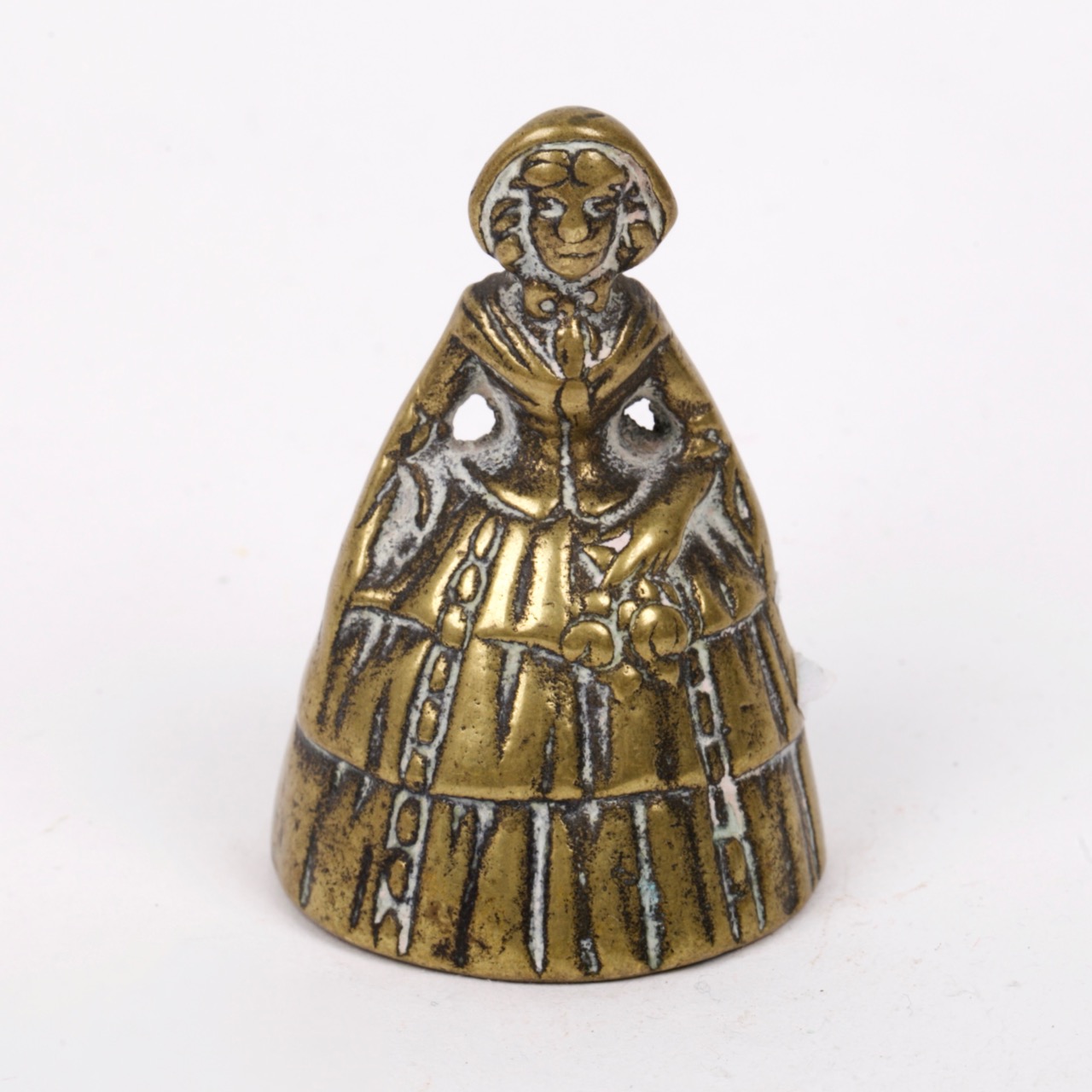 Antique brass bell in a shape of a old woman
