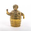 Bell in a shape of a barrel with a boy.