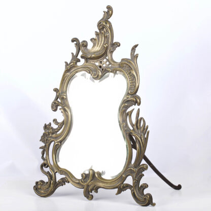 Vintage Ornate Rococo Style oval brass  table mirror on stand. 