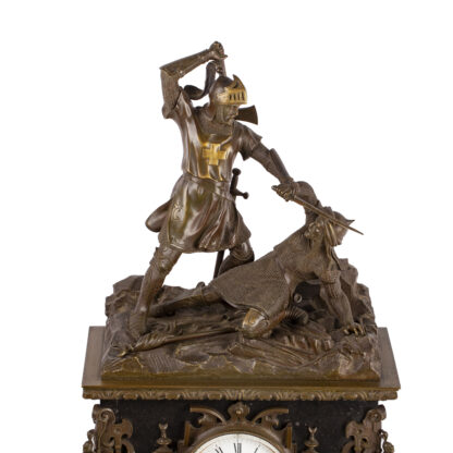 Antique large mantel clock made of bronze and black marble depicting a battle between a crusader and a Turk or Moor.