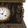 Antique large mantel clock made of bronze and black marble depicting a battle between a crusader and a Turk or Moor.