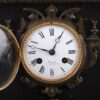 Antique large mantel clock made of bronze and black marble depicting a battle between a crusader and a Turk or Moor.