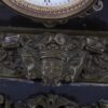 Antique large mantel clock made of bronze and black marble depicting a battle between a crusader and a Turk or Moor.