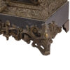 Antique large mantel clock made of bronze and black marble depicting a battle between a crusader and a Turk or Moor.