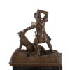 Antique large mantel clock made of bronze and black marble depicting a battle between a crusader and a Turk or Moor.