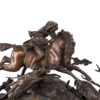 A nice detailed with hunting scene Antique Mantel clock with double patina and marble. Enamel dial and mechanism signed R. Bouvier Bruxelles.