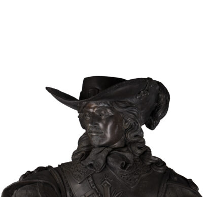 Bronze sculpture of a musketeer in full human growth. Very detailed and well made.