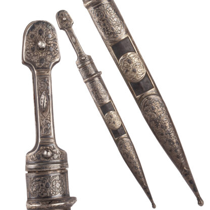 A Georgian Kindjal in Silver Scabbard. The blade is decorated with floral ornaments and engraved with the name of the master: Did Asha?
