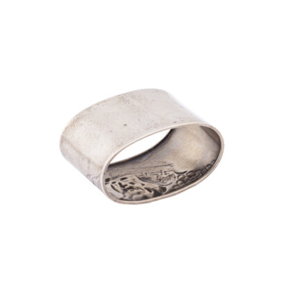 A Russian cast silver napkin ring from the series of “Bogatir zastava”. Makers mark of M. Tarasov. Moscow, 1908-1917. Dimensions: 3.7 x 6 x 3.5 cm. Weight: 32.5 g.