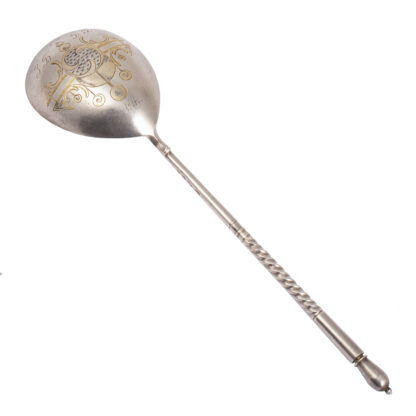 A large silver sauce spoon