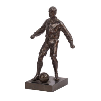 20th century spelter figure of a football player standing beside a ball